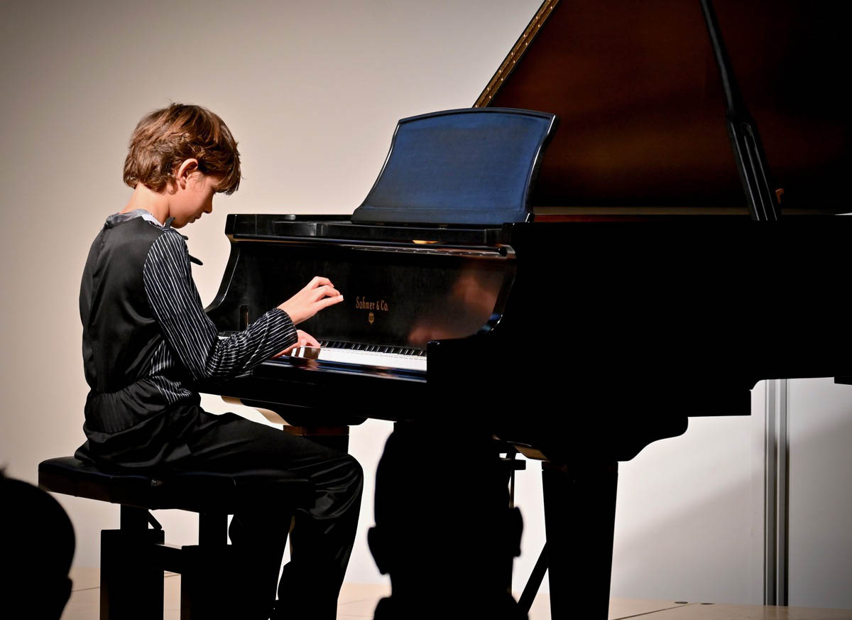 services-01 student-playing-piano